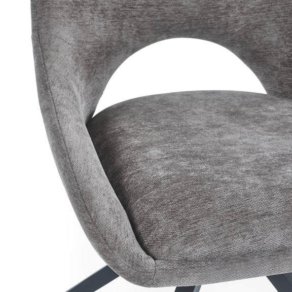 Gray upholstered chair with a white background