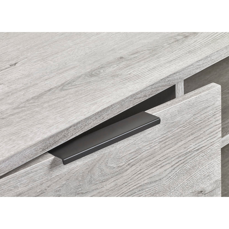 Close-up of a wooden drawer with a black handle on a white background