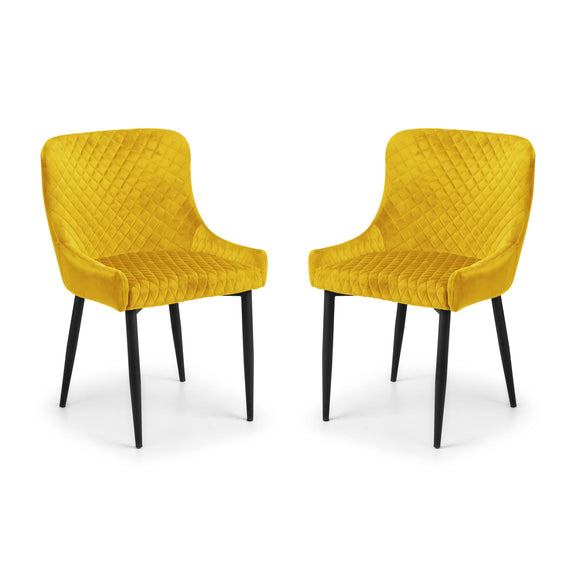 Two yellow chairs with quilted design on a white background