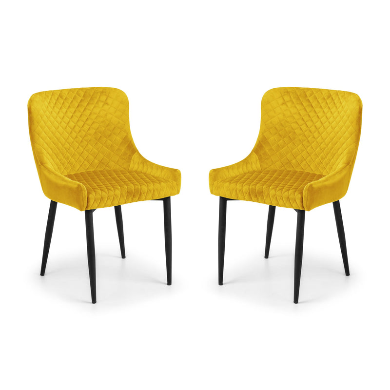 Two yellow chairs with quilted design on a white background