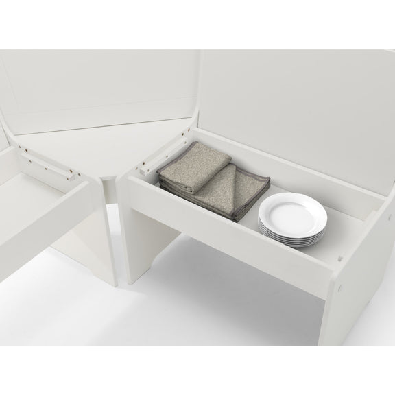 White storage bench with folded gray blanket and white plates on a white background