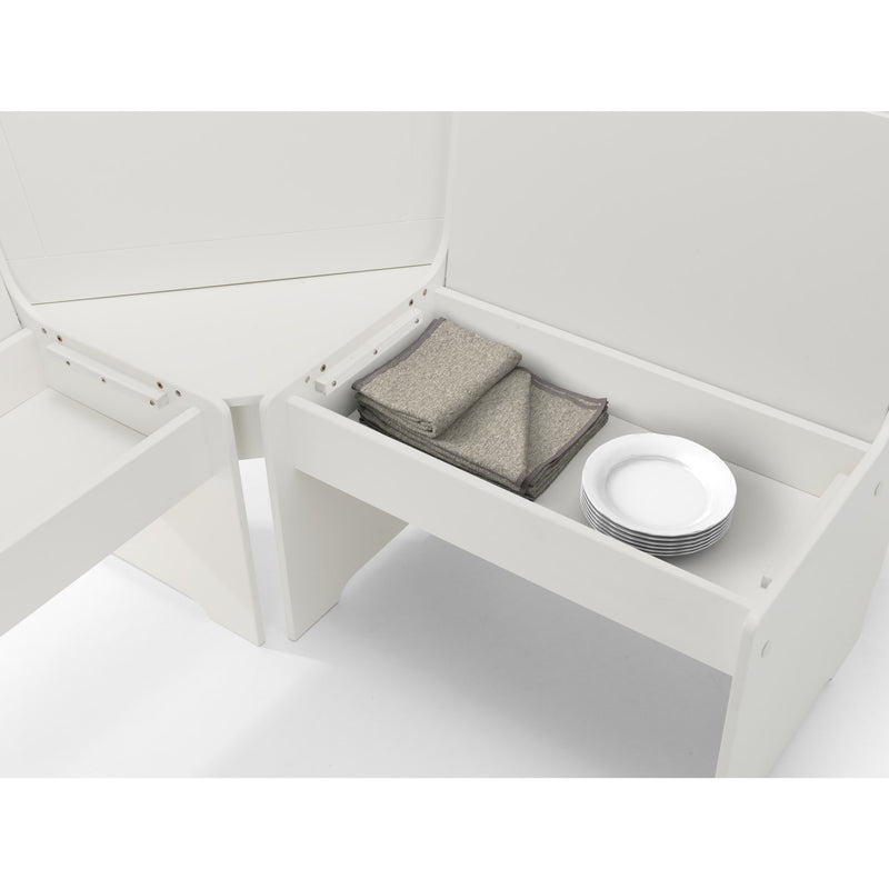 White storage bench with folded gray blanket and white plates on a white background