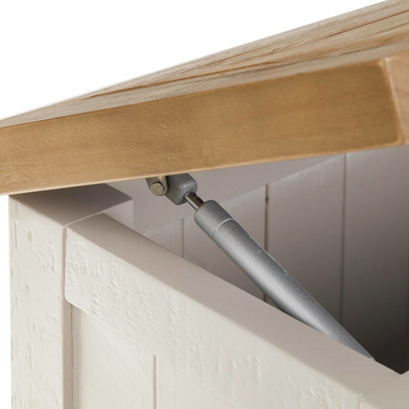 Close-up of a wooden shelf with a metal support inside a white cabinet.