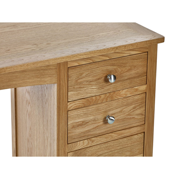 Wooden desk with two drawers and metal handles on a white background
