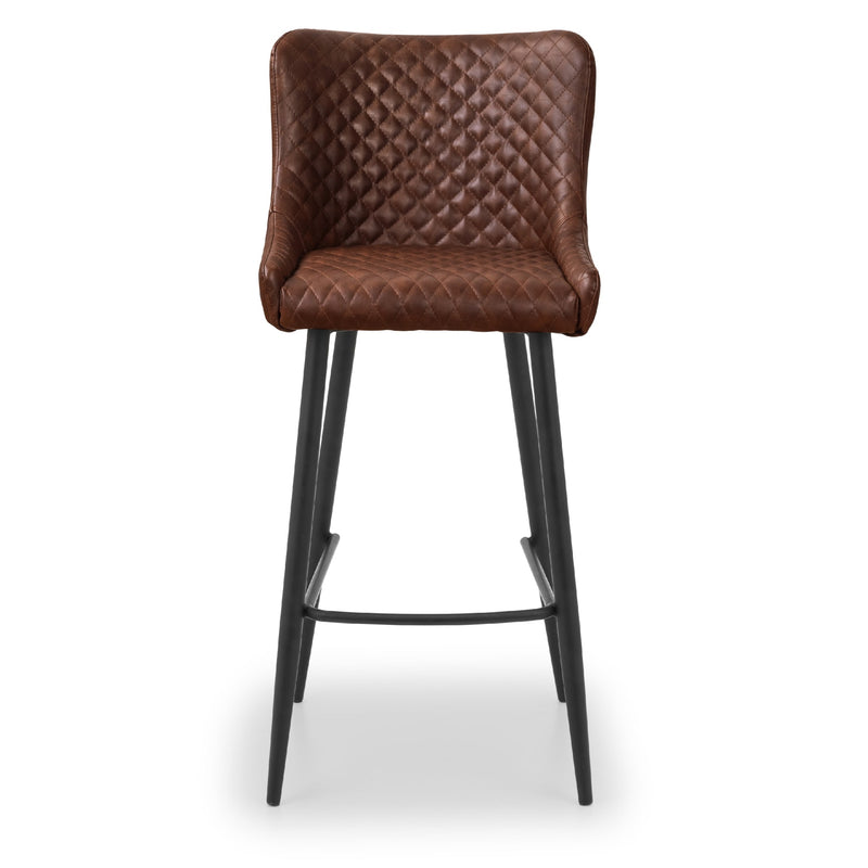 Brown quilted bar stool with black legs on a white background