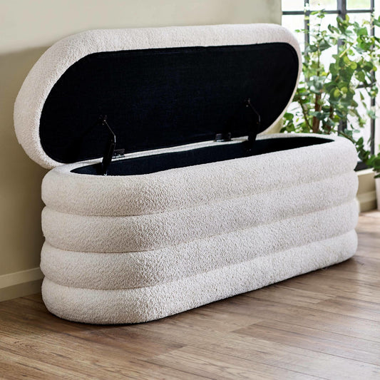 Inflatable storage bench with a textured surface on a wooden floor.