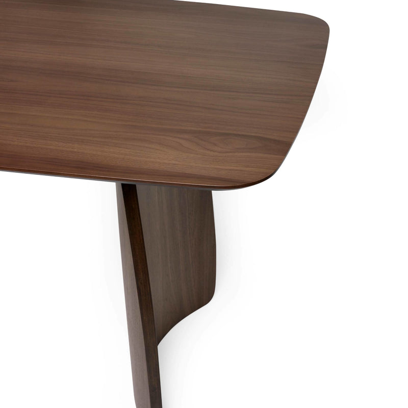 Close-up of a wooden table corner on a white background