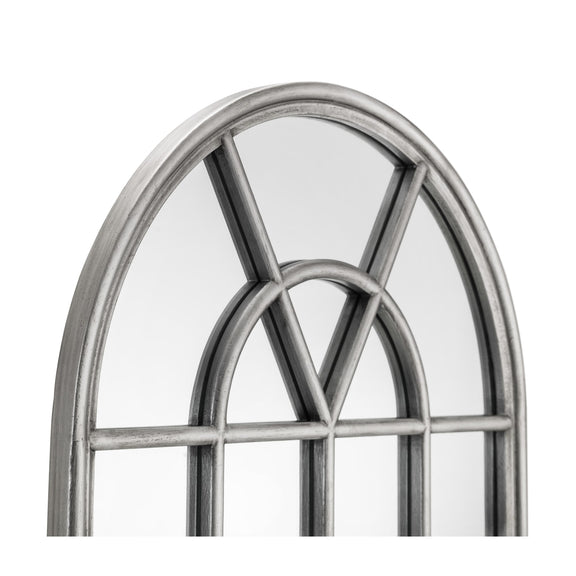 Metallic decorative window frame with an arch design on a white background