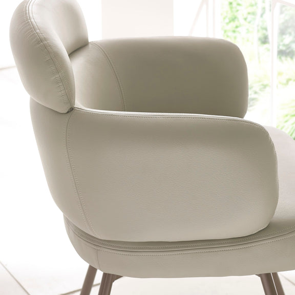 Beige armchair in a bright room with natural light