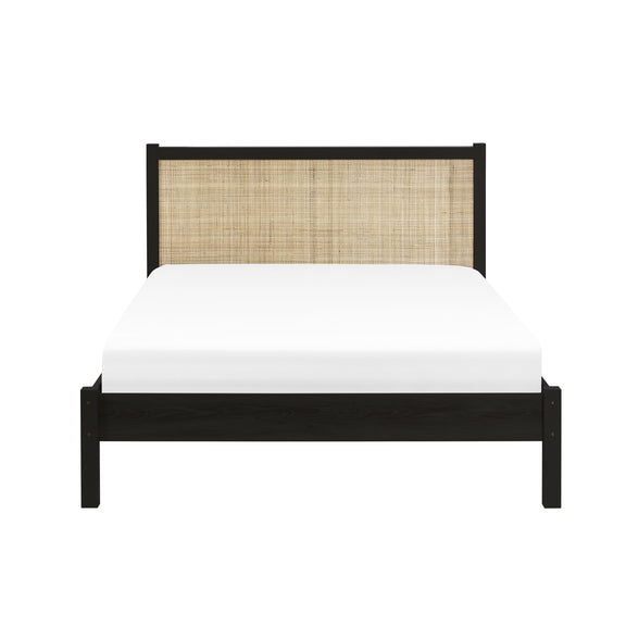 Bed with black frame and woven headboard on a white background
