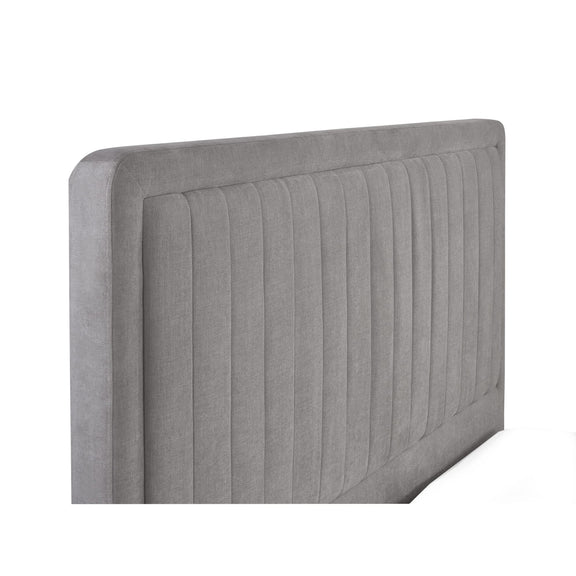 Gray upholstered headboard with a ribbed texture on a white background