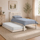 White bed frame with blue bedding in a bedroom setting.