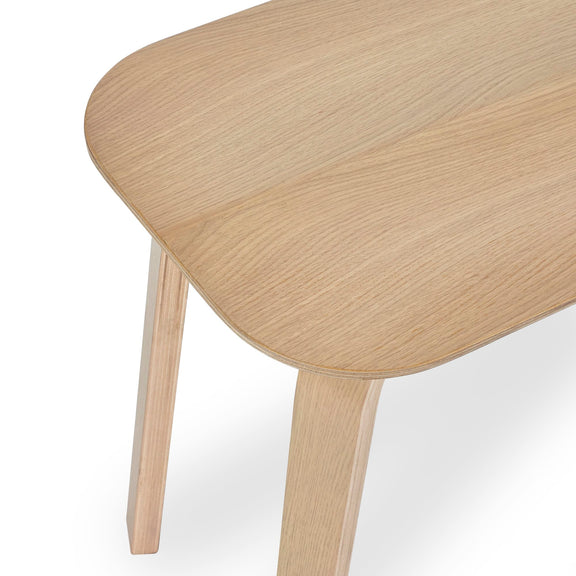 Wooden table with a light finish on a white background