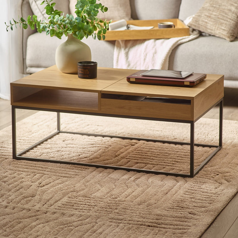 Wooden coffee table with decorative items in a living room setting