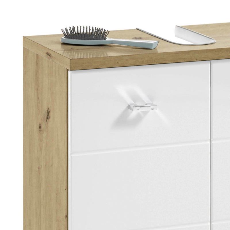 White cabinet with wooden top and decorative item on a white background