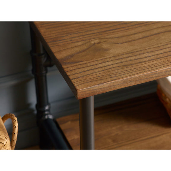 Wooden desk with metal legs on a blurred background