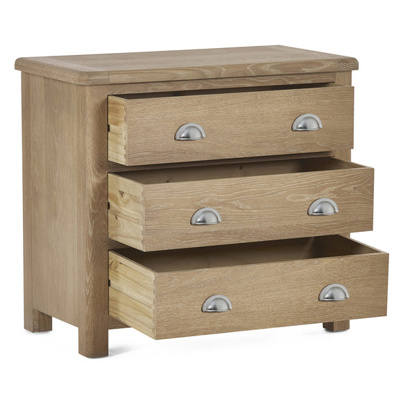 Wooden chest of drawers with three drawers on a white background