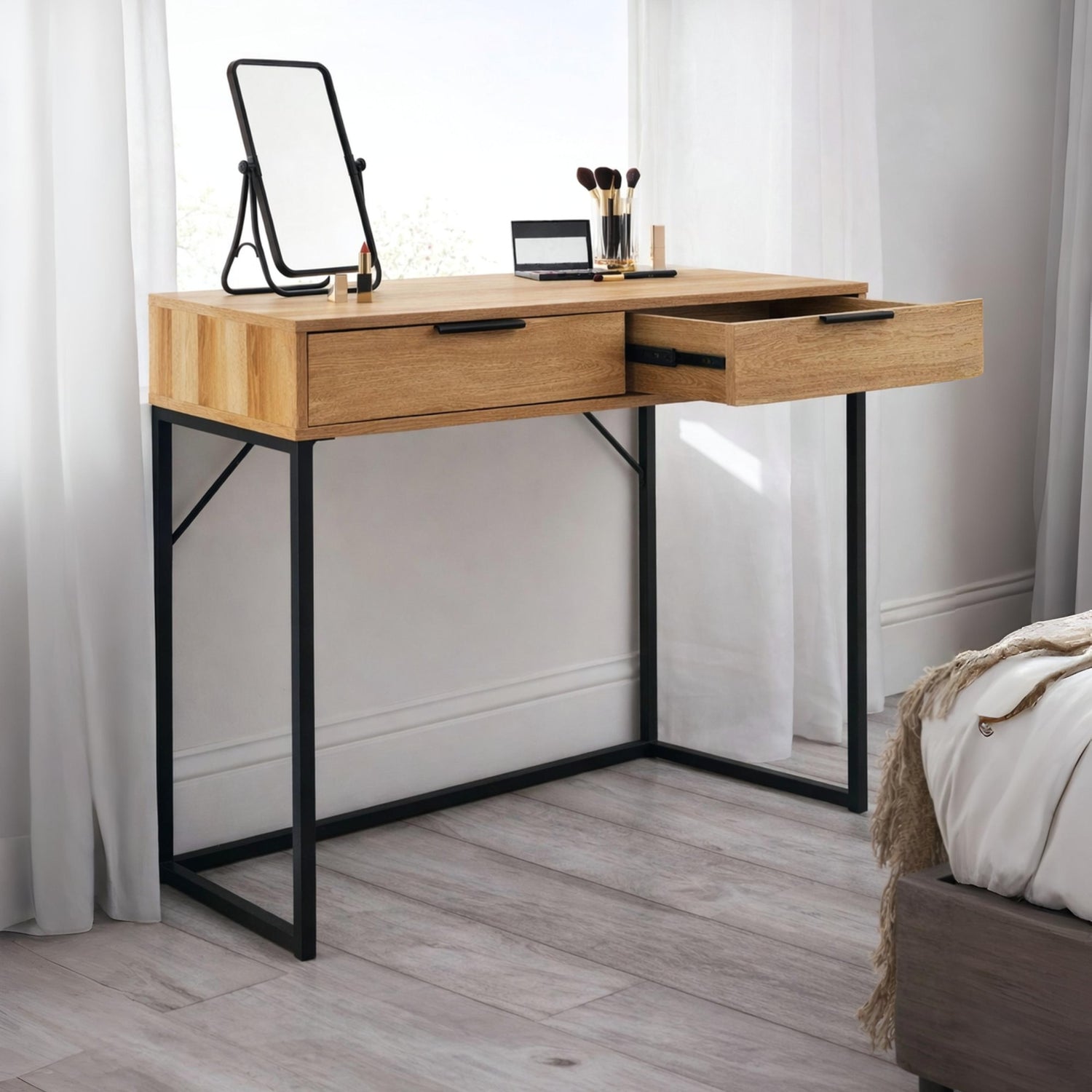 Wooden desk with black metal legs in a room setting