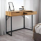 Wooden desk with black metal legs in a room setting