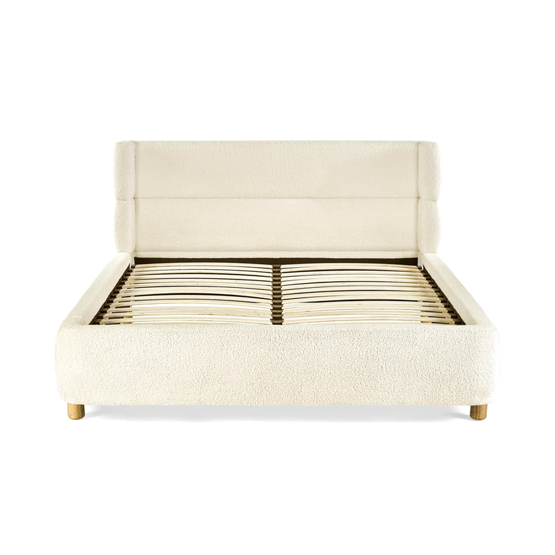 Beige upholstered bed frame on a white background