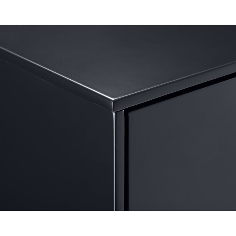 Close-up of a black metallic surface with a reflective finish