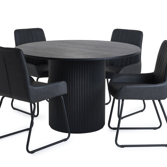 Round black dining table with four matching chairs on a white background