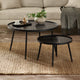 Black marble coffee table with a smaller matching side table in a living room setting.