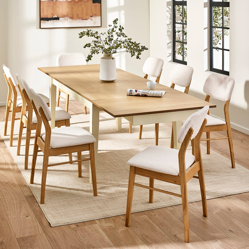 Dining room with wooden table and chairs on a rug