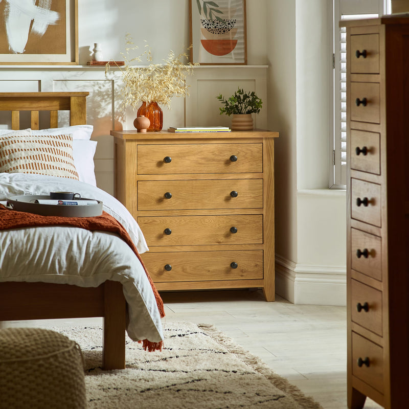 Wooden dresser in a bedroom with decor items on top