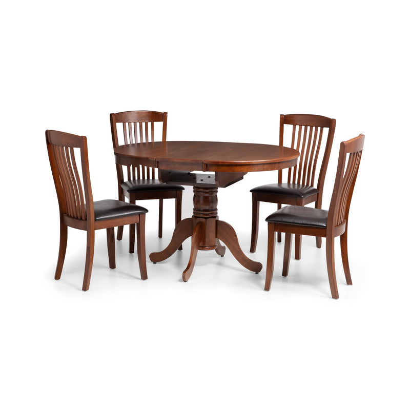 Wooden dining table with four matching chairs on a white background