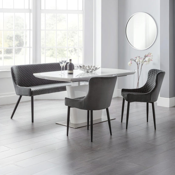 Modern dining set with a table and chairs in a bright room.