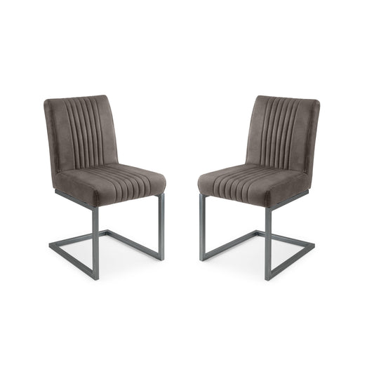 Two brown upholstered chairs with metal legs on a white background