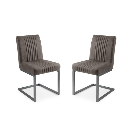 Two brown upholstered chairs with metal legs on a white background