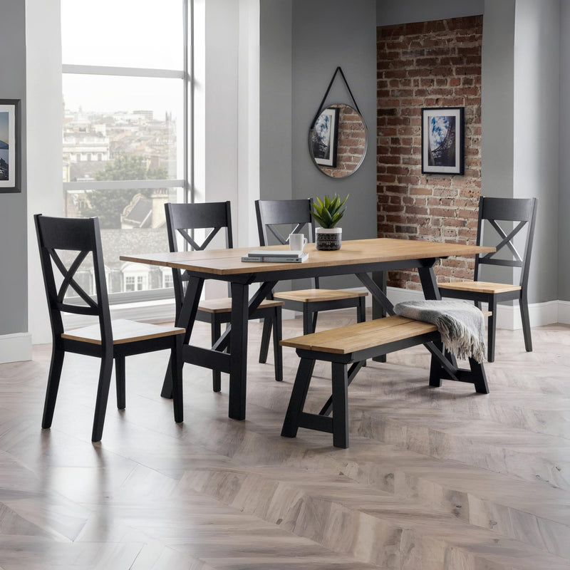 Dining room with a wooden table and chairs in a modern interior setting.