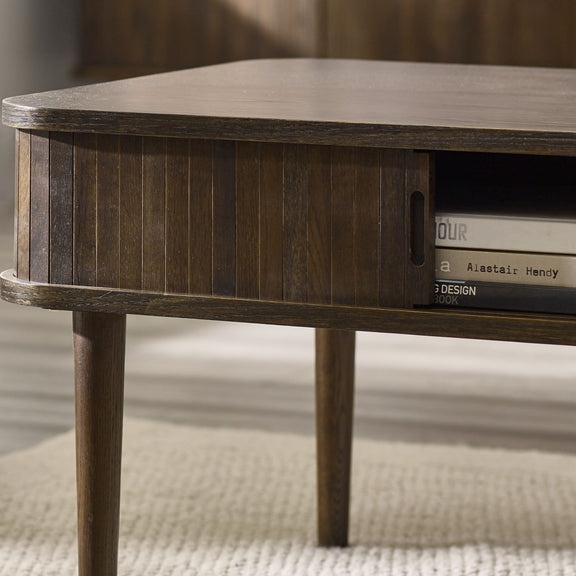 Wooden side table with books on a neutral background