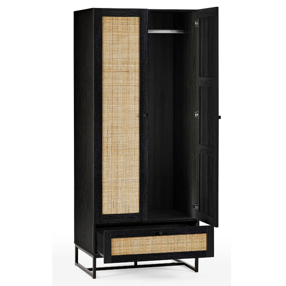 Black wardrobe with rattan accents on a white background