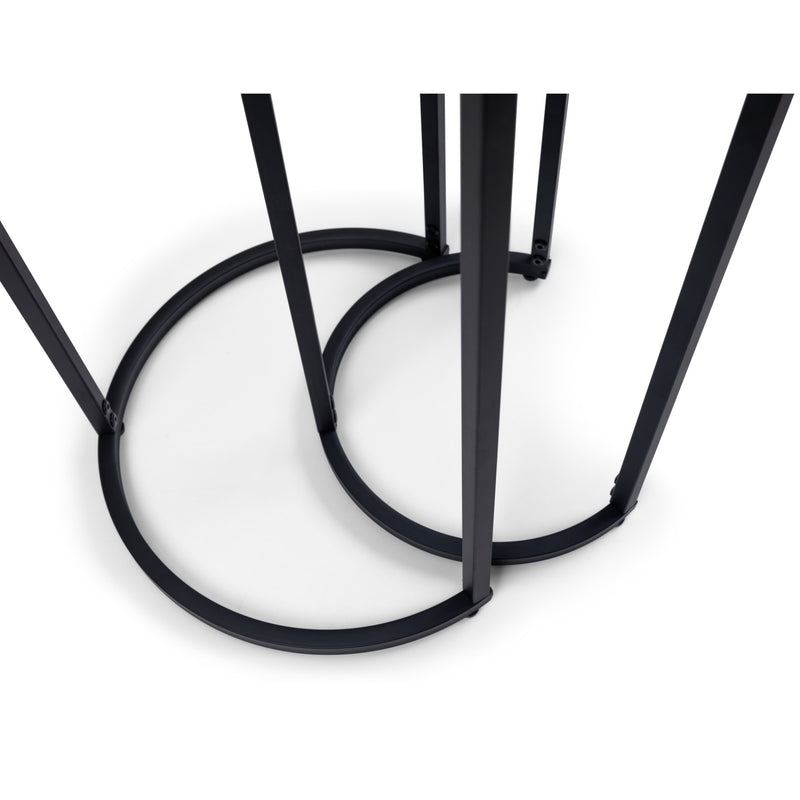 Close-up of a black metal chair frame on a white background