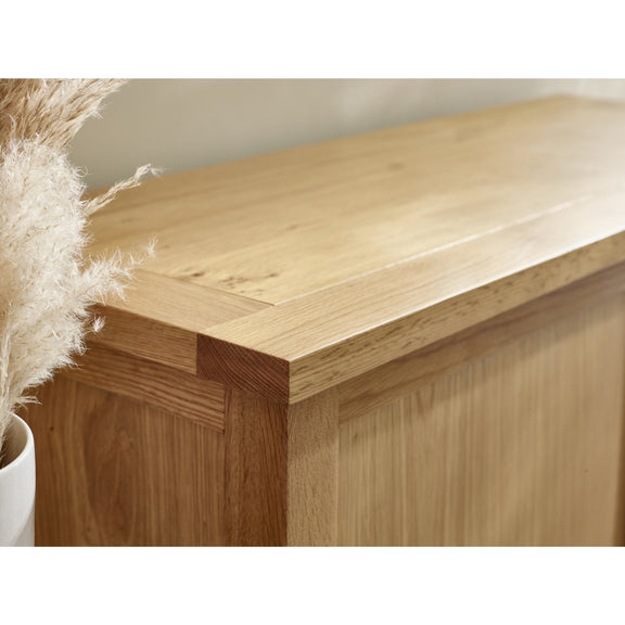 Wooden cabinet corner with a neutral background
