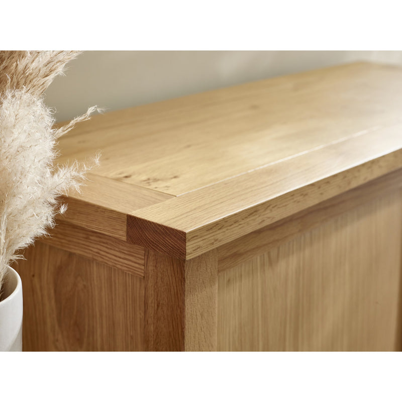Wooden cabinet corner with a neutral background