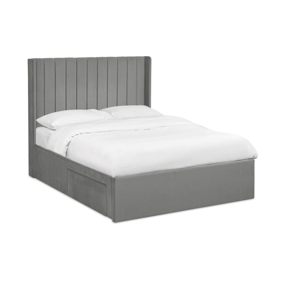 Navy bed frame with white bedding on a white background