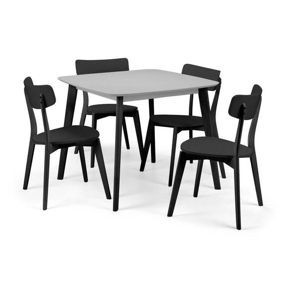 Dining table set with four black chairs on a white background