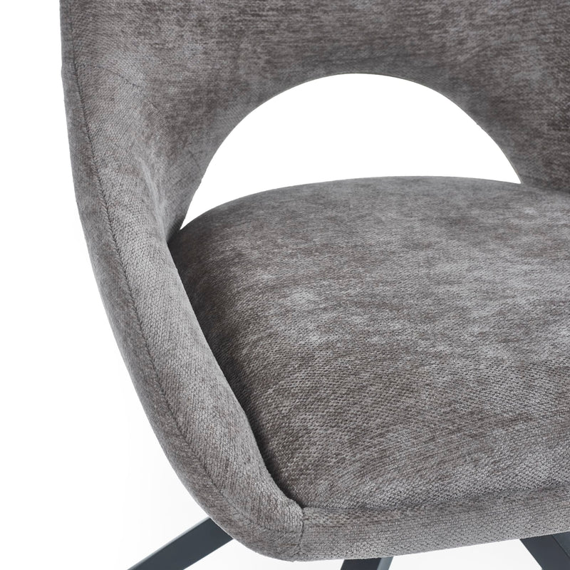 Gray upholstered chair with a white background