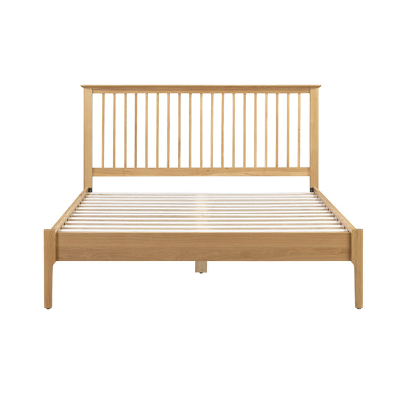 Wooden bed frame with slatted design on a white background
