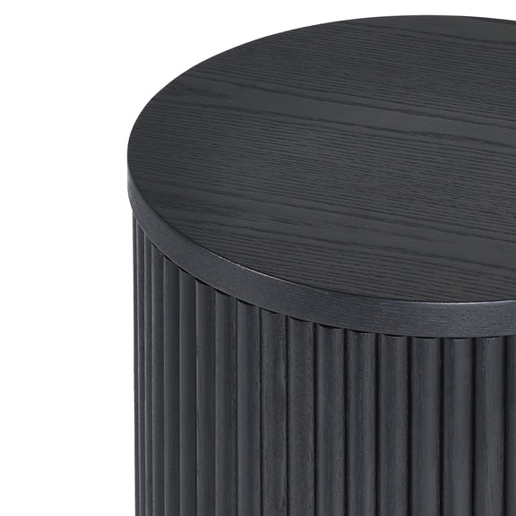 Round wooden side table with a ribbed cylindrical base on a white background
