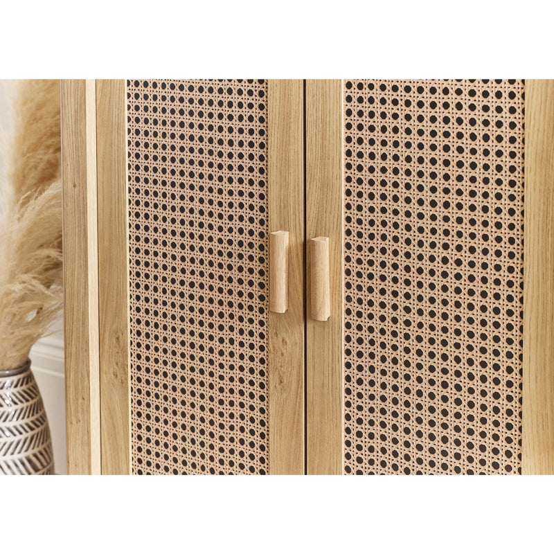Wooden cabinet with wicker pattern and two handles on a white background