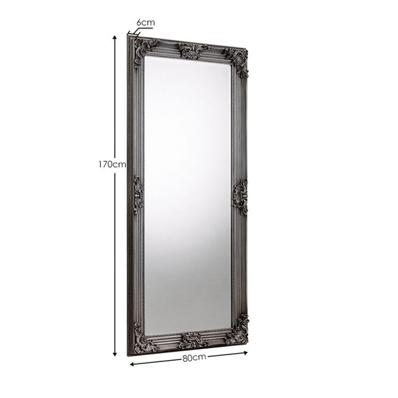 Decorative mirror with ornate frame and measurement details on a white background