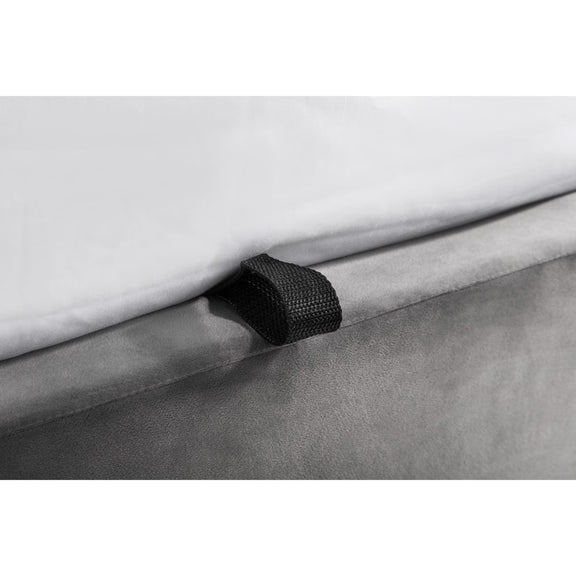 Close-up of a gray fabric roll with a black tie, on a white background
