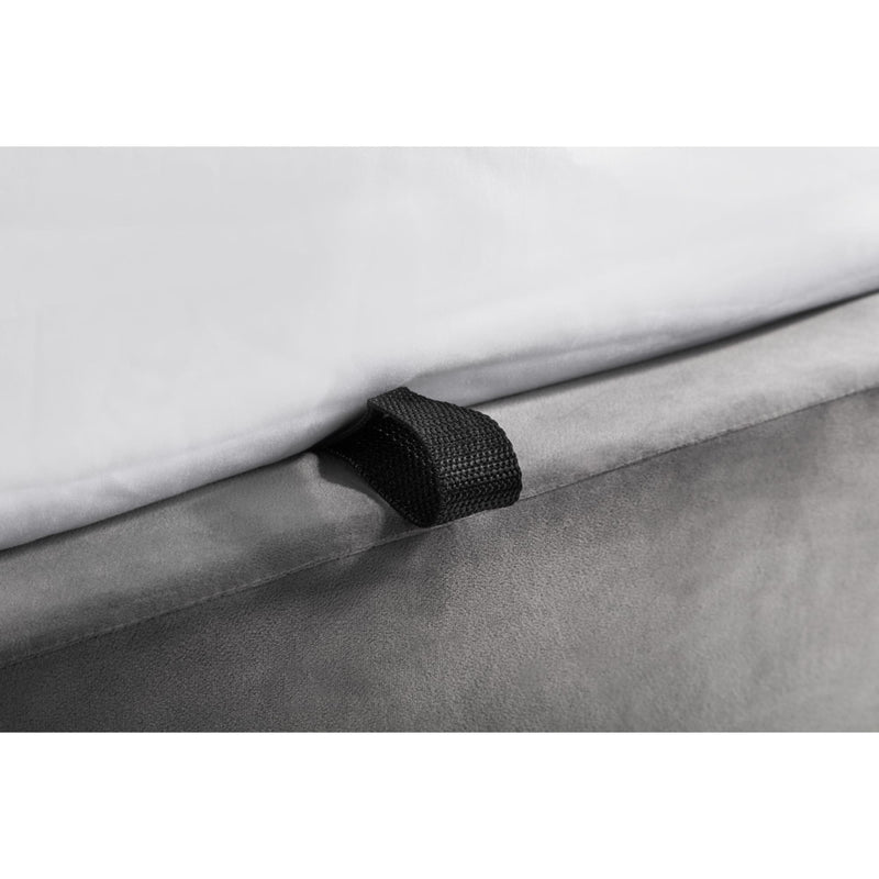 Close-up of a gray fabric roll with a black tie, on a white background