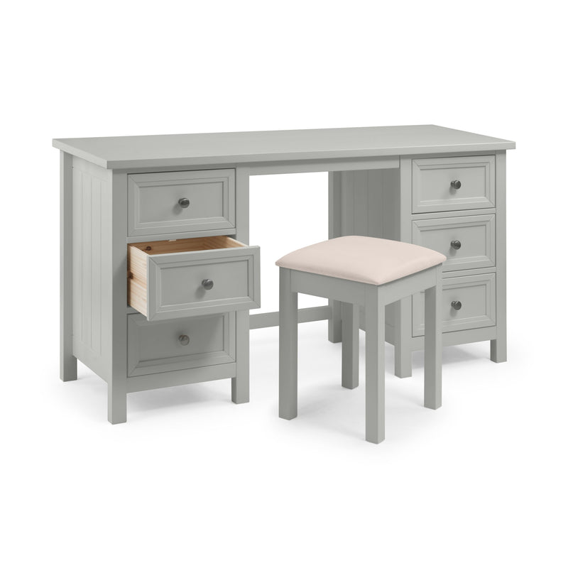 Gray desk with multiple drawers and a matching stool on a white background