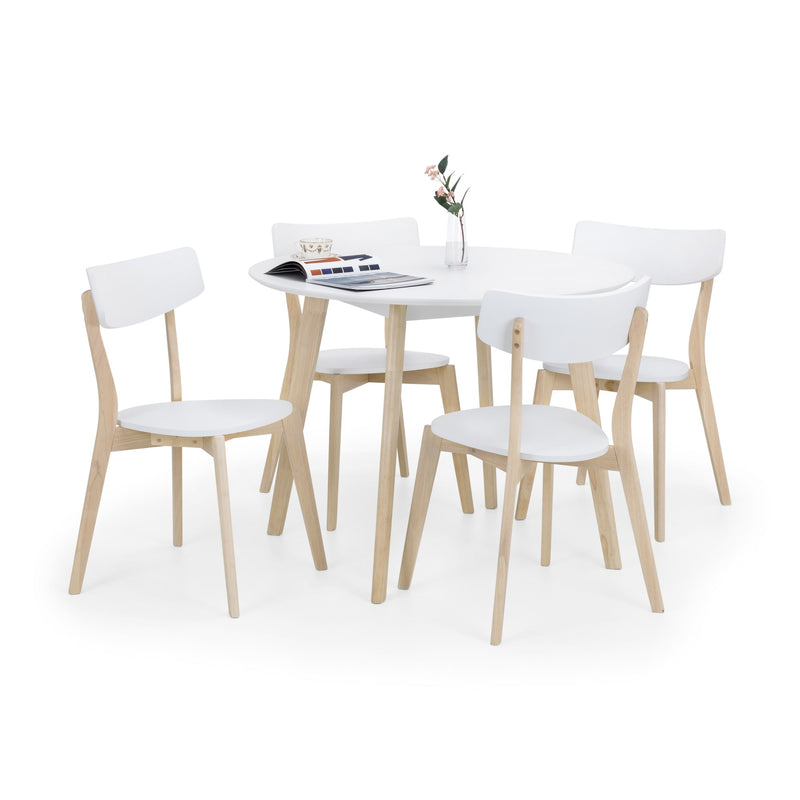 Dining table set with white chairs on a white background